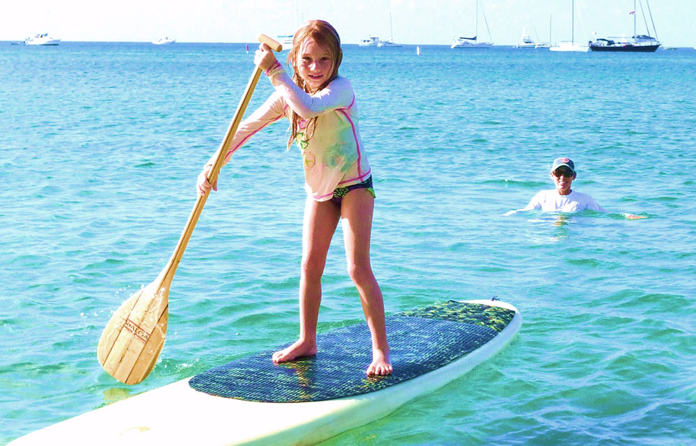 Kauai Style Vacations girl stand up paddle photo